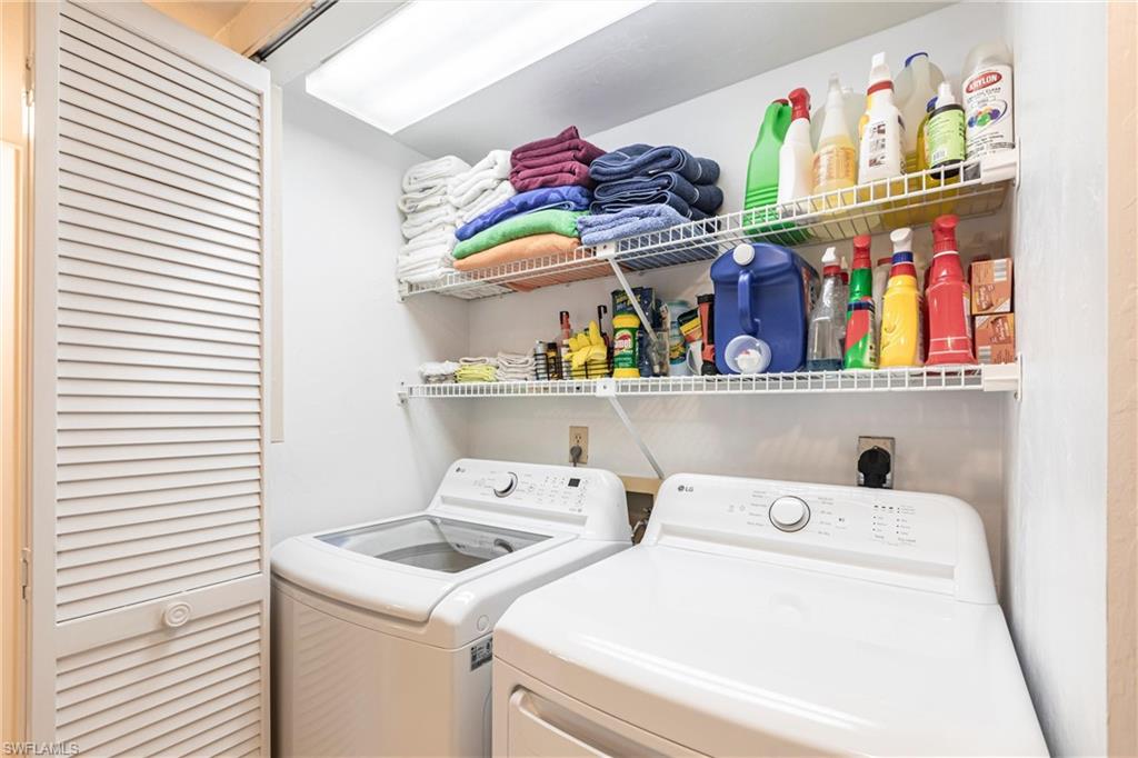 Laundry room featuring washing machine and clothes dryer