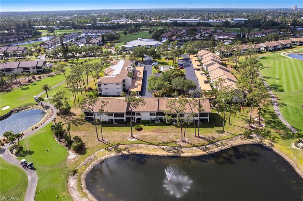 View of property location with a nearby pond