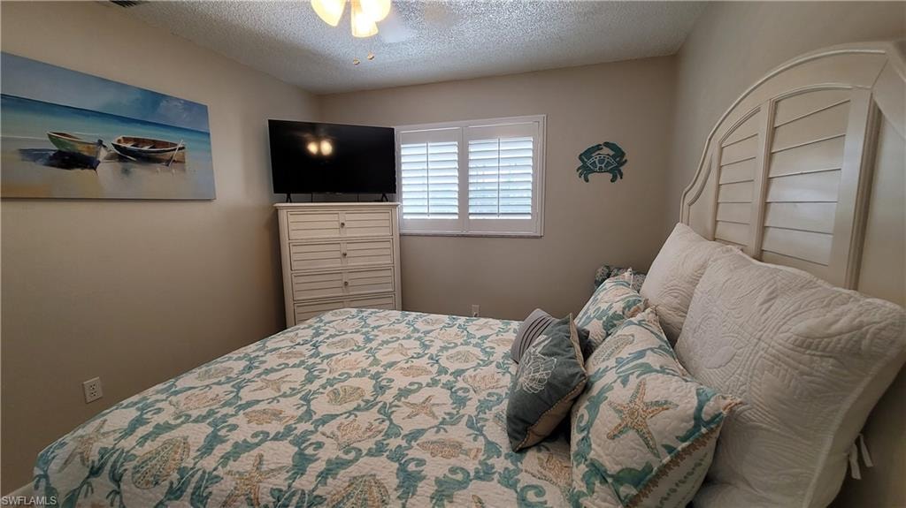 Bedroom with a textured ceiling