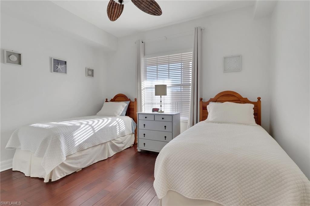 Bedroom featuring wood finished floors and a ceiling fan