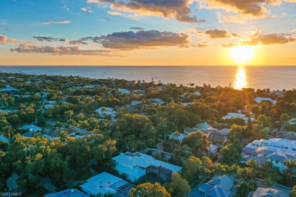 Aerial view with a water view and a residential view