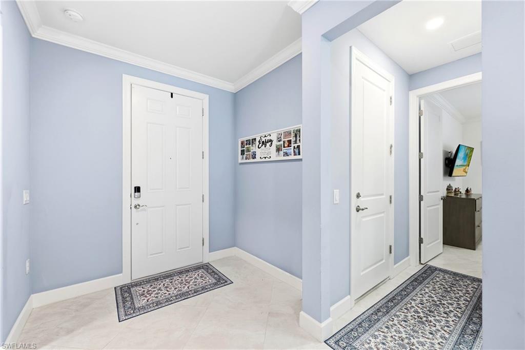 Entryway featuring ornamental molding