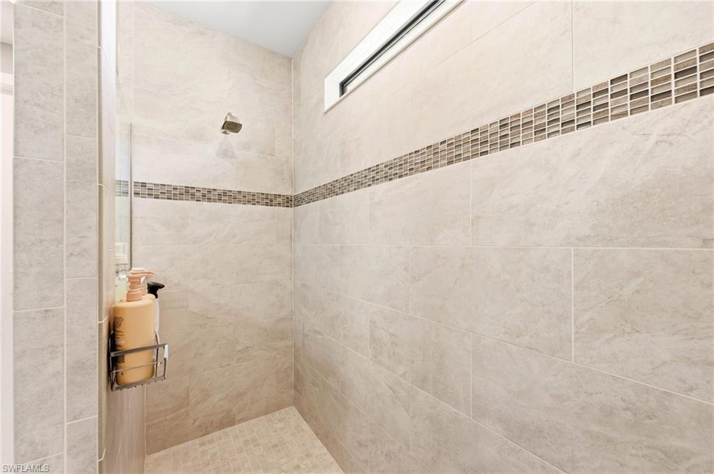 Bathroom featuring a tile shower