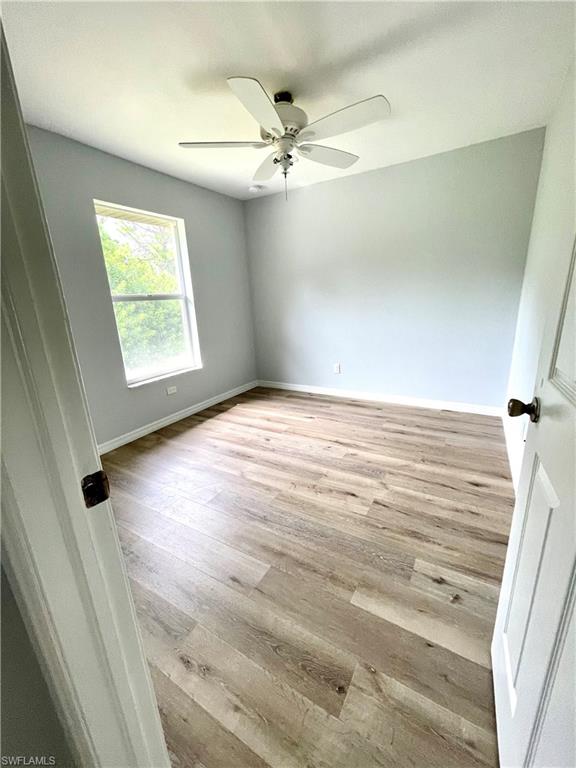 Unfurnished bedroom featuring light wood-style flooring and a ceiling fan