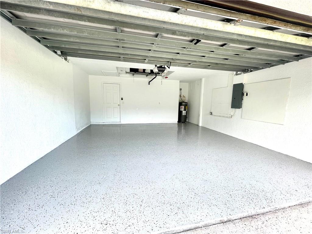 Garage with electric panel and electric water heater