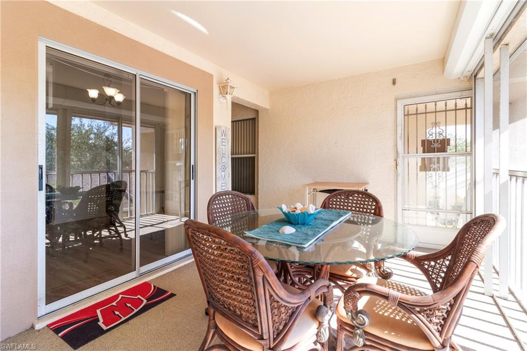 Front screened lanai with slicing doors to kitchen