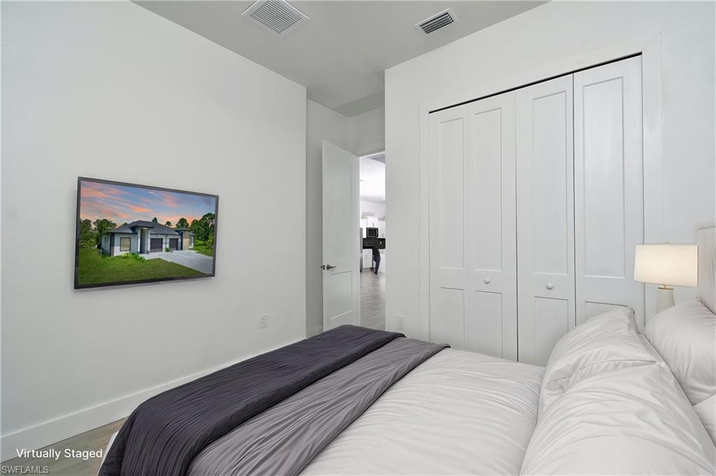 Bedroom featuring a closet and wood finished floors