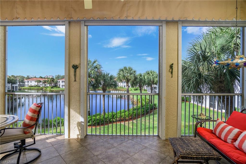 Sunroom / solarium with a water view