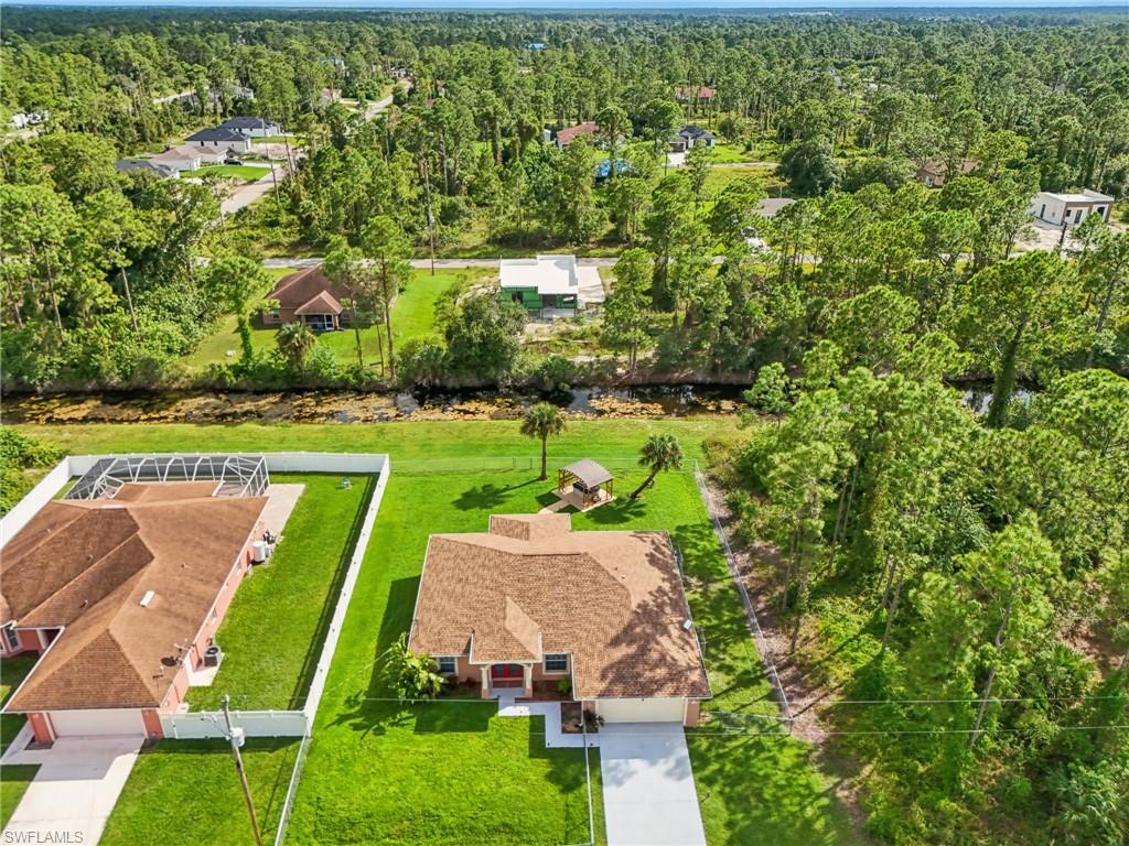 Aerial view of residential area with a heavily wooded area