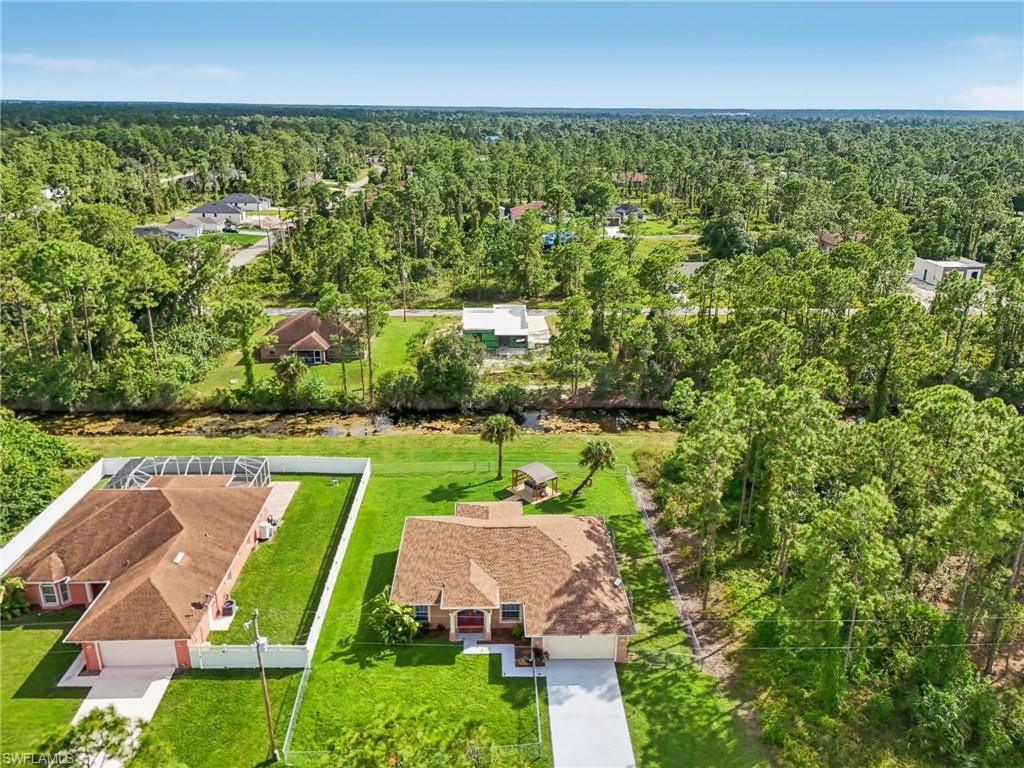 Aerial view of residential area with a heavily wooded area