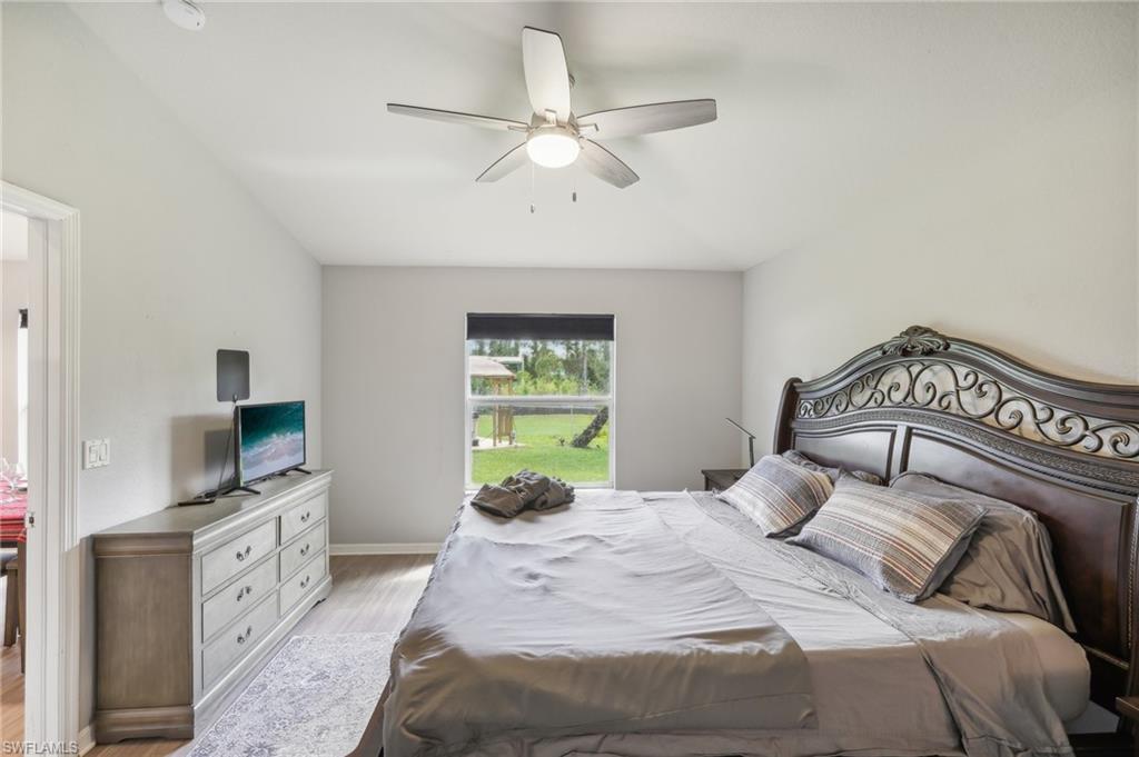 Bedroom featuring wood finished floors and ceiling fan