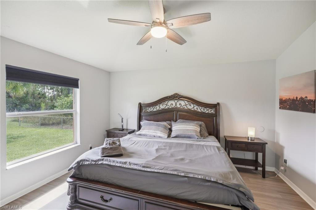Bedroom featuring ceiling fan and light wood finished floors