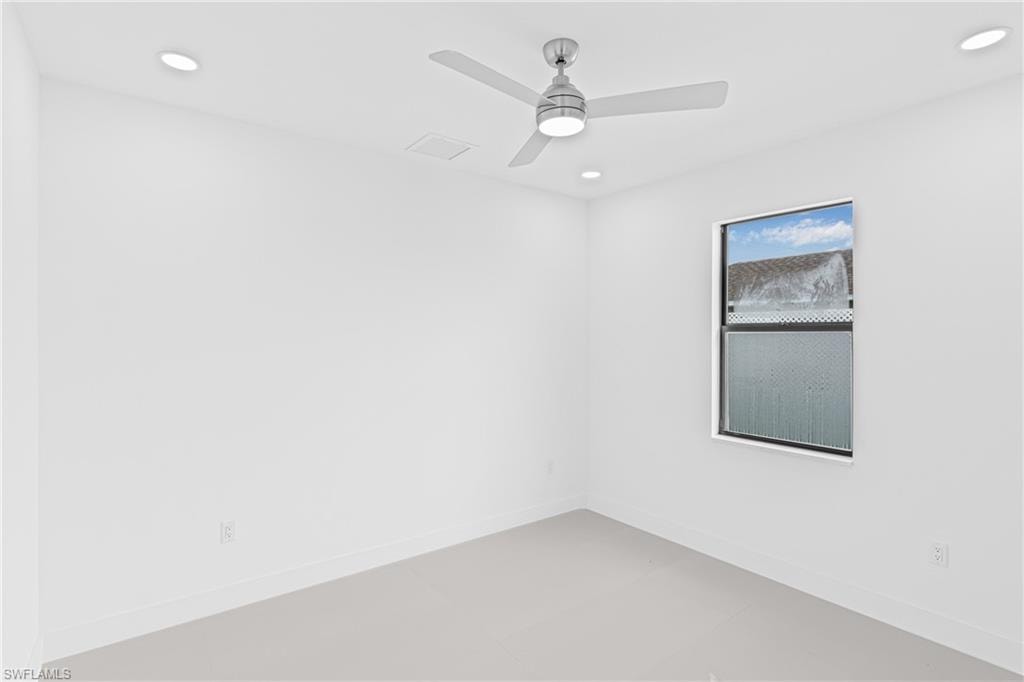 Unfurnished room with recessed lighting and a ceiling fan