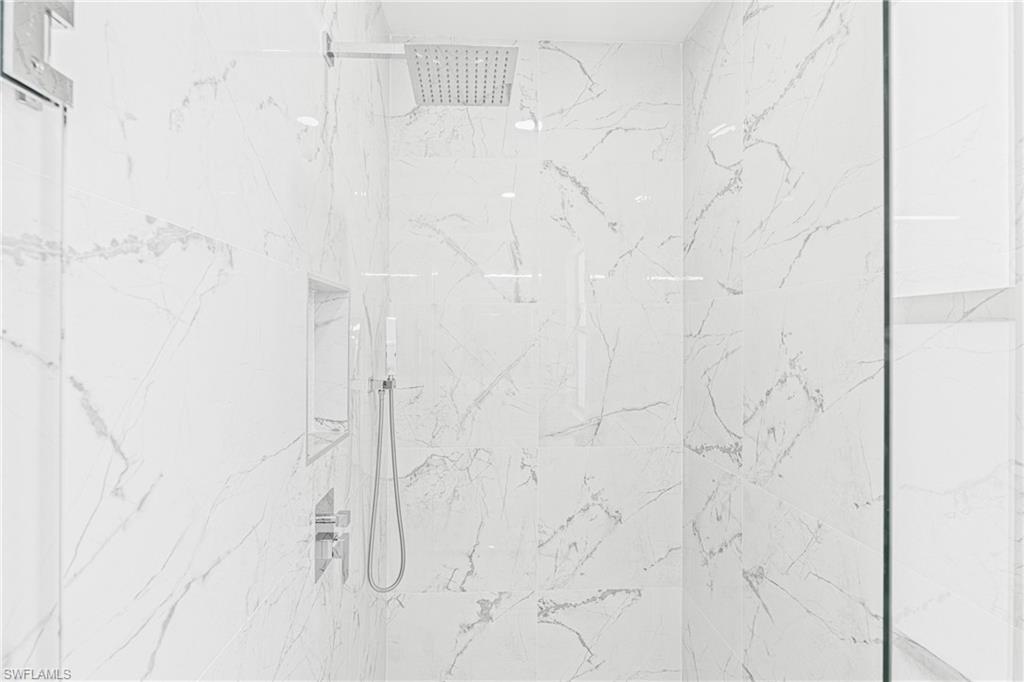 Bathroom view of a marble finish shower