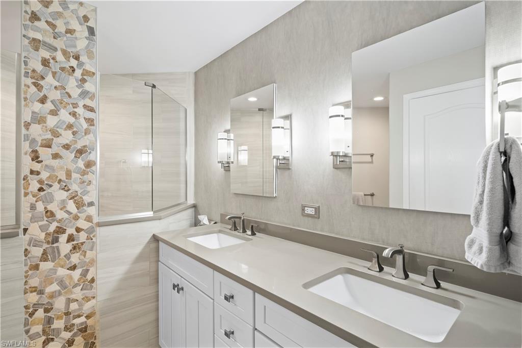 Primary ensuite bath has been remodeled and redesigned and has dual vanity quartz countertops and walk in shower. Private water closet.