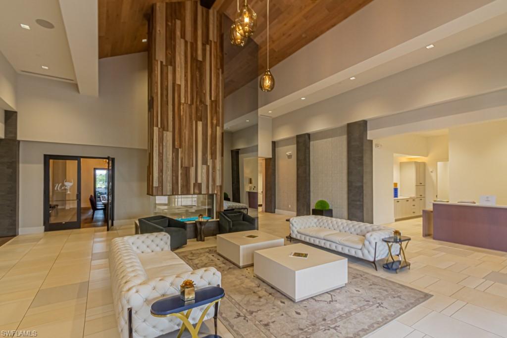 Reception area of the Barrel House with floor to ceiling fireplace, wine lockers, & dining room