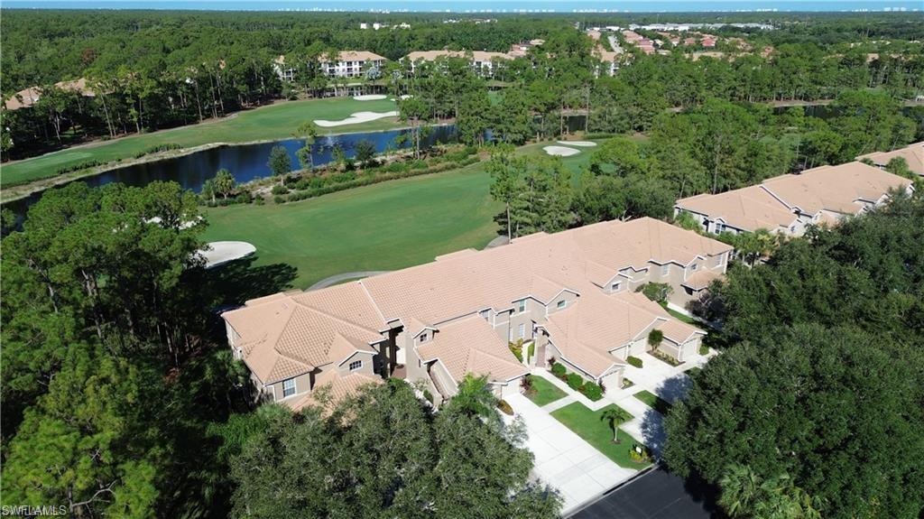 Aerial view of property's location with a large body of water and a golf course