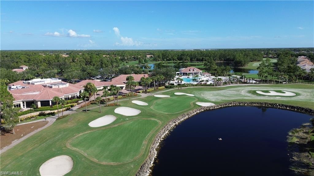 View of property location featuring a golf course and a large body of water