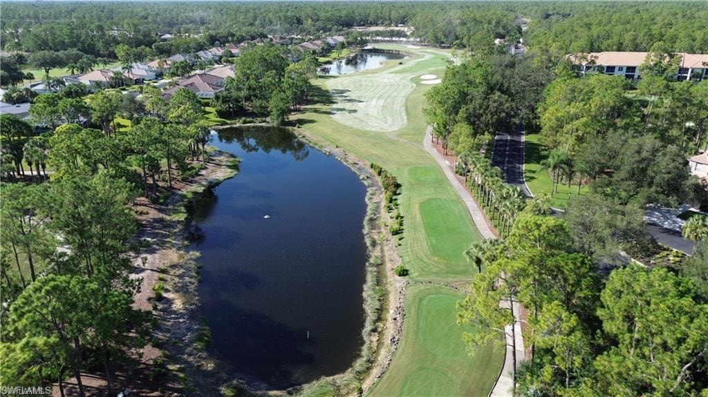 View of property location featuring a local golf course and a large body of water