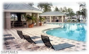 Community pool featuring a patio area
