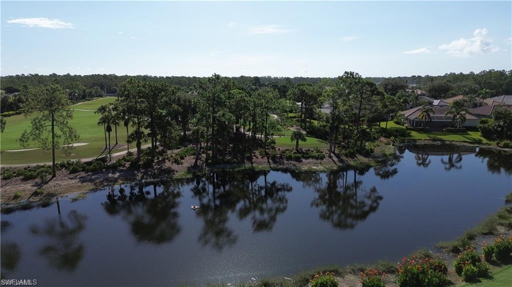 Water view with a tree filled landscape