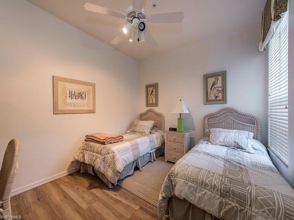 Bedroom featuring wood finished floors and a ceiling fan