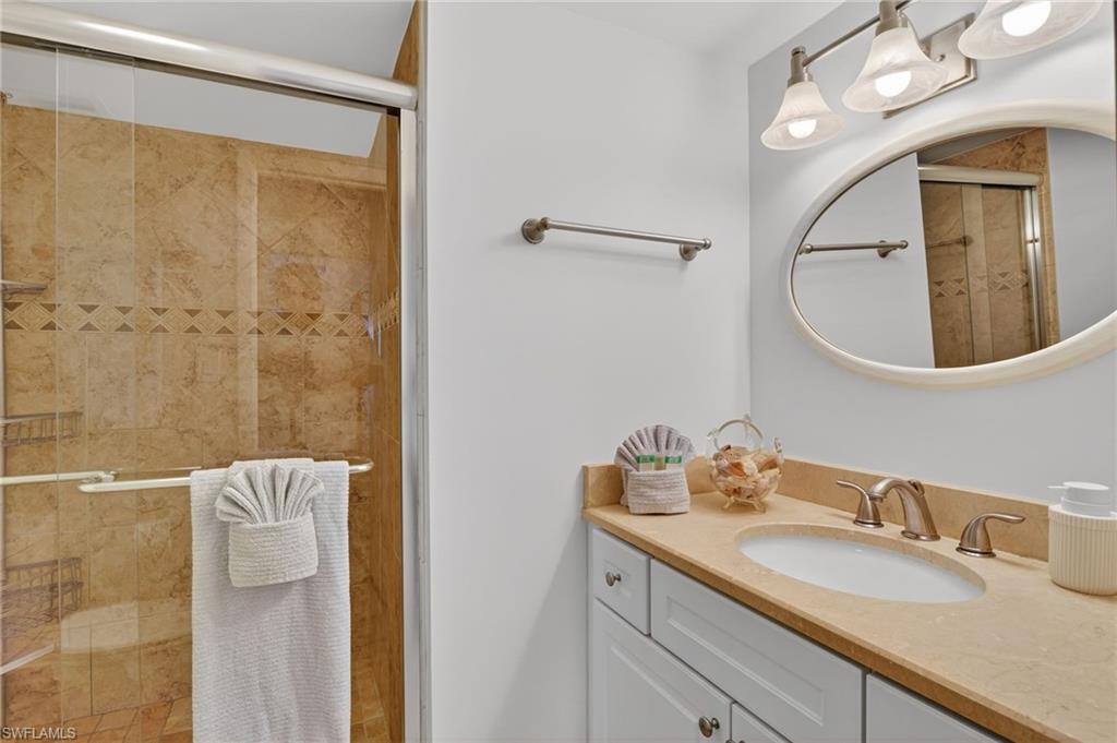 Guest bathroom with a shower stall and vanity