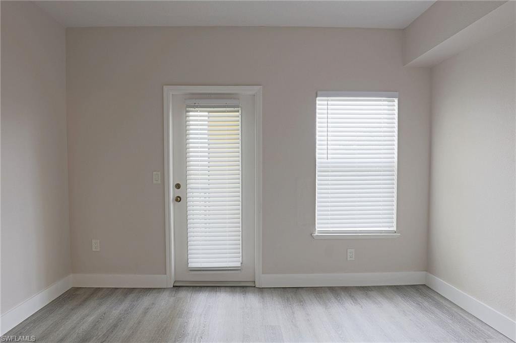 Spare room with light wood finished floors and baseboards