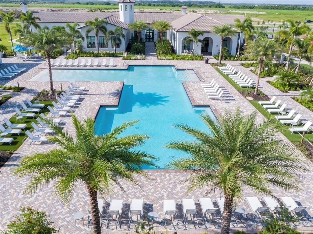 Community pool with a patio area and a pergola