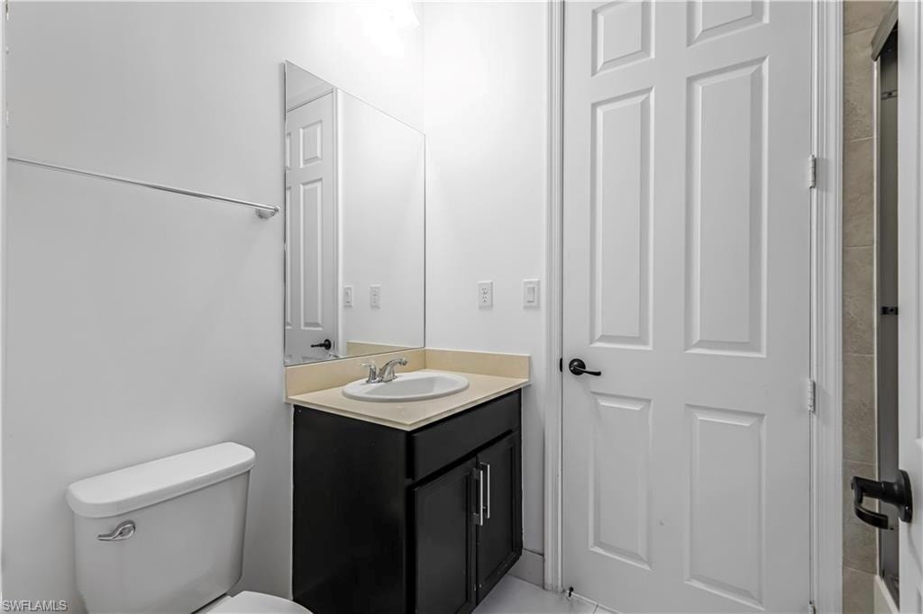 Bathroom with vanity and toilet