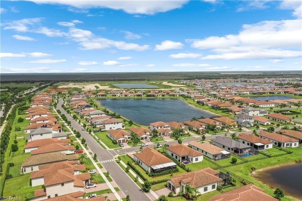 Aerial perspective of suburban area with a large body of water