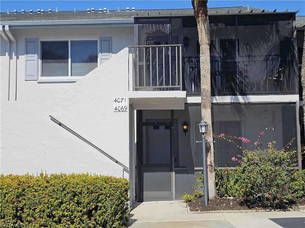 Property entrance with stucco siding