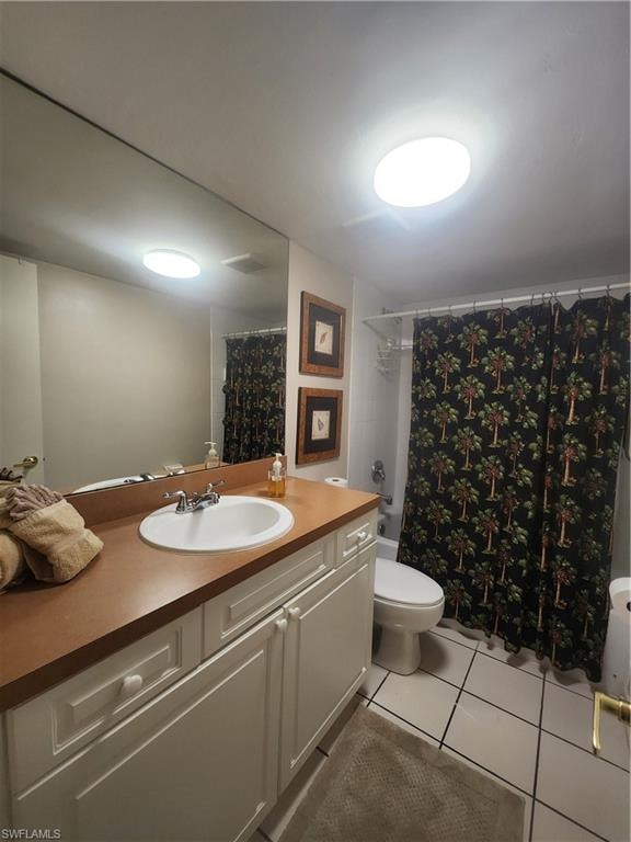 Full bathroom with vanity, light tile patterned flooring, and shower / bath combo