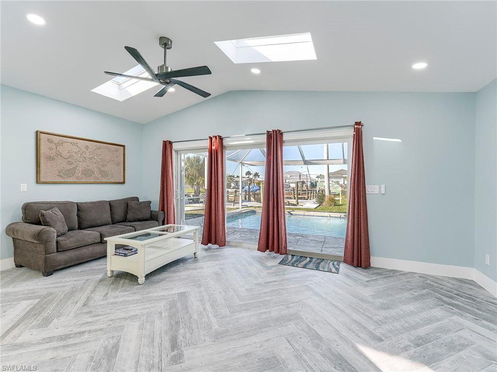 Den with views to pool and canal