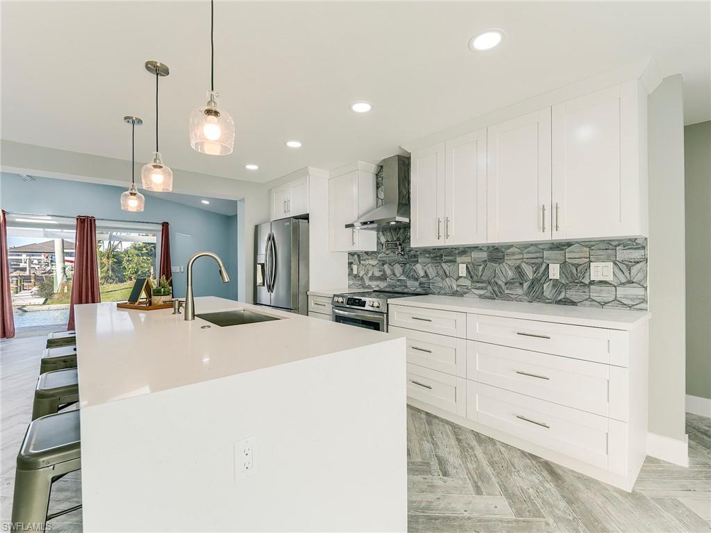 Waterfall island with perfect kitchen layout and room for 4 barstools