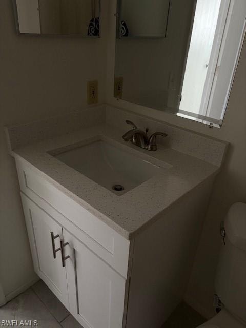 Bathroom with vanity and toilet