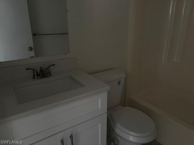 Full bath featuring vanity and washtub / shower combination