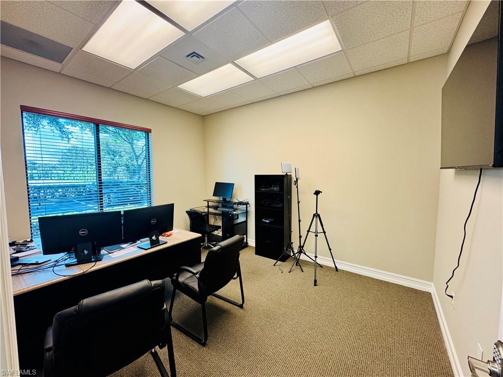 Office space featuring a drop ceiling