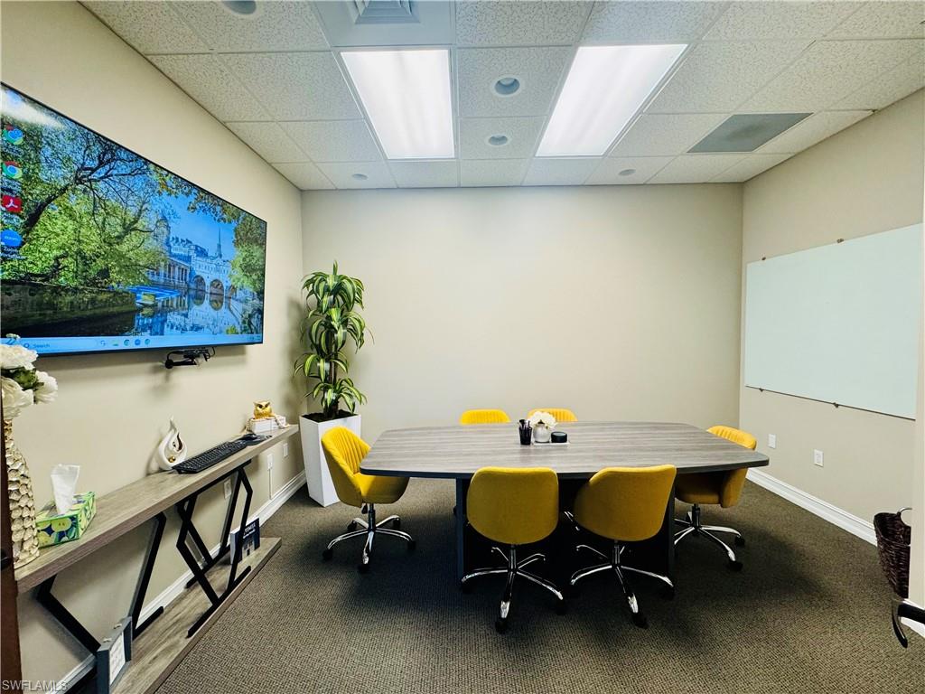 Office area featuring a paneled ceiling