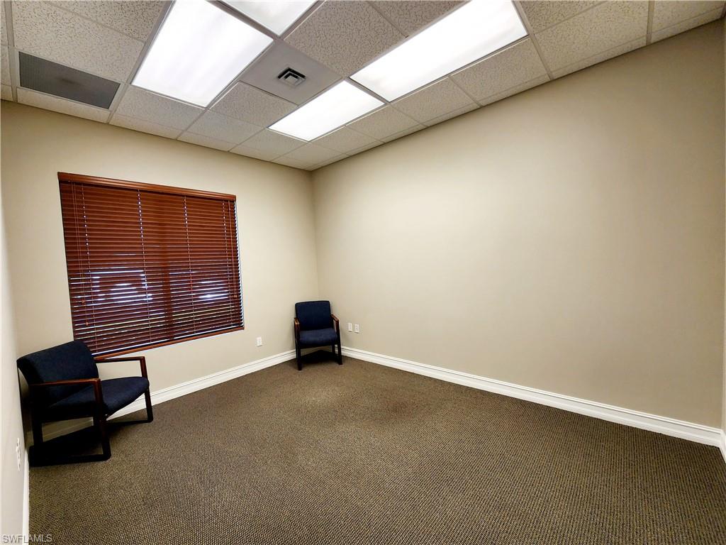 Unfurnished room with a drop ceiling