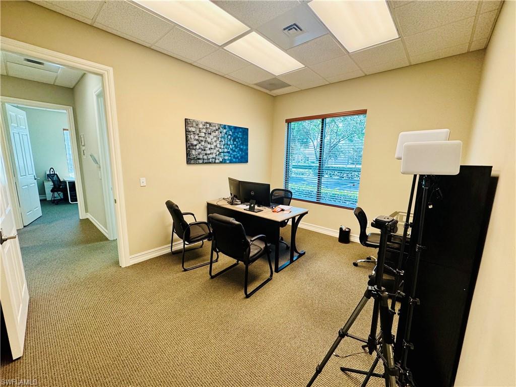 Office featuring a drop ceiling