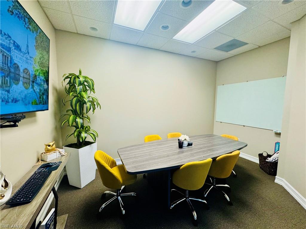 Office area featuring a paneled ceiling