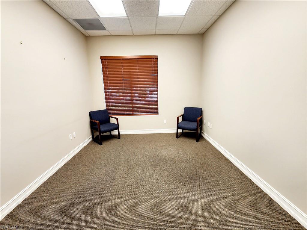 Unfurnished room featuring a drop ceiling