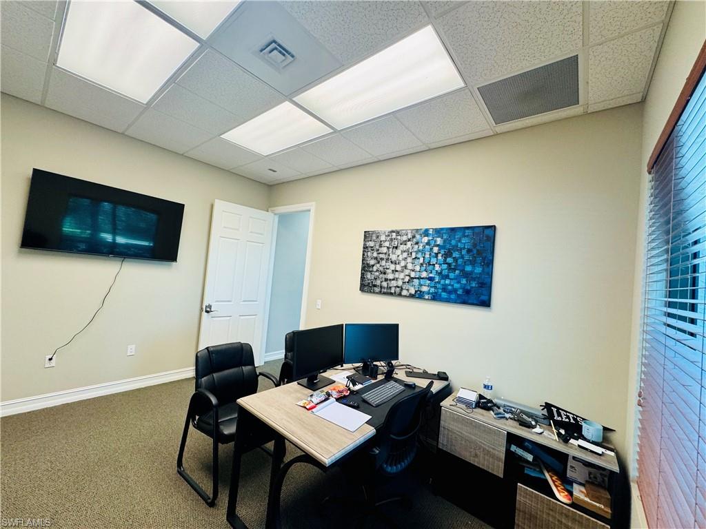 Office space featuring a paneled ceiling