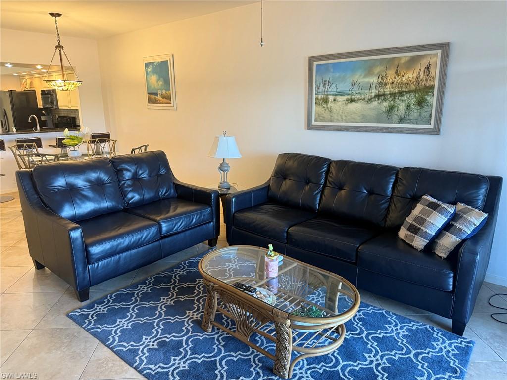 Living room with light tile patterned floors