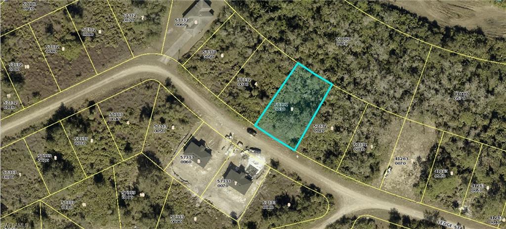 Aerial map of property and surrounding area featuring property parcel outlined