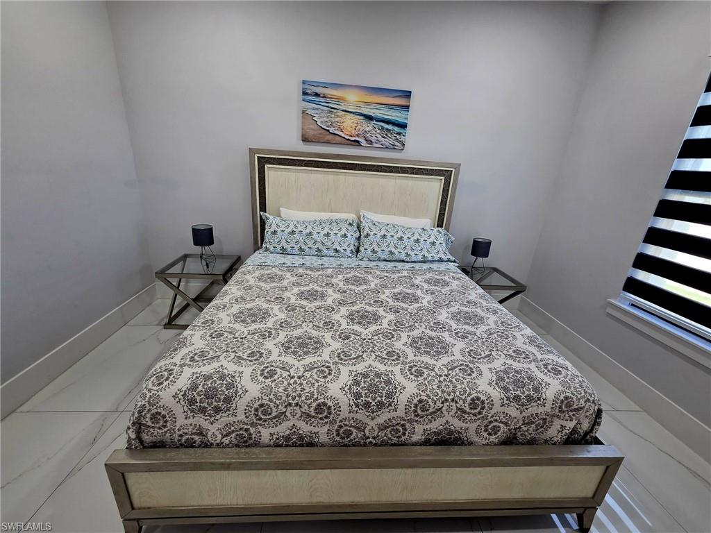 Bedroom featuring baseboards