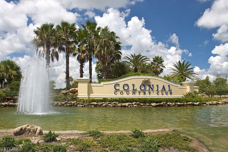 Community / neighborhood sign featuring a water view