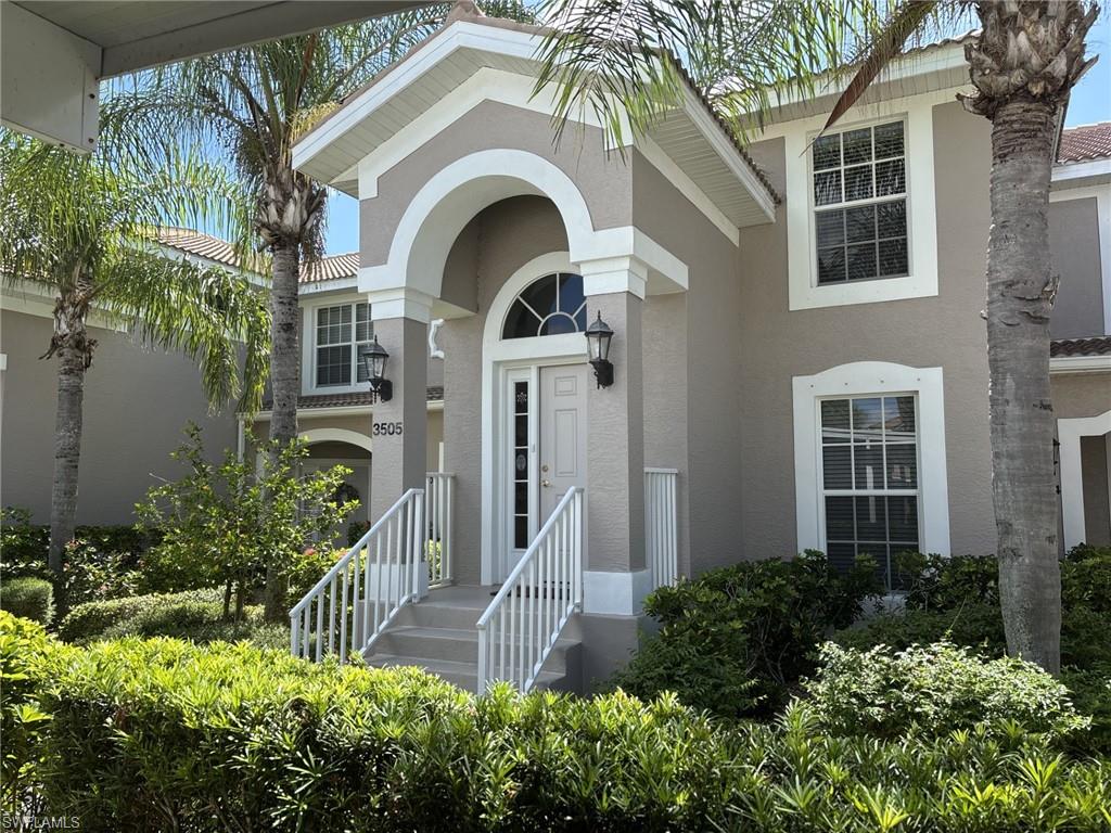 Doorway to property with stucco siding
