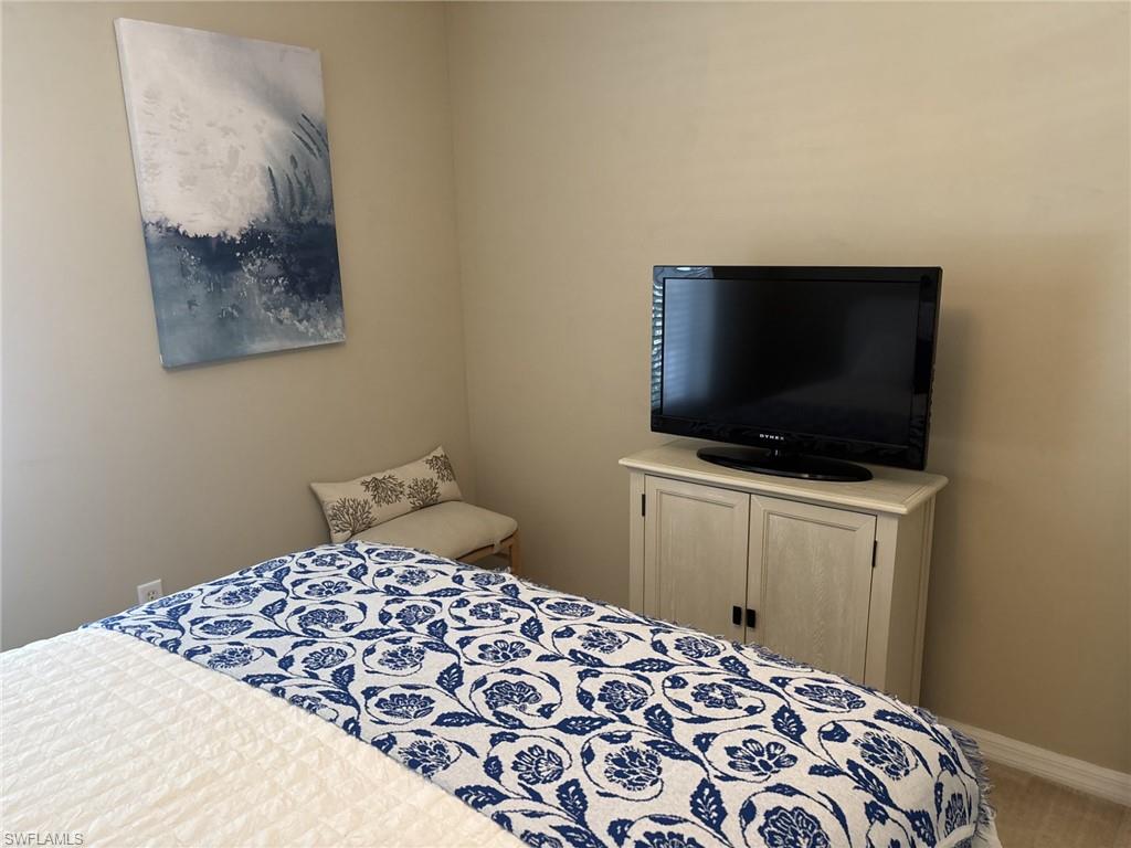 Bedroom featuring baseboards